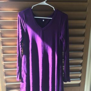 A purple long sleeve dress.
